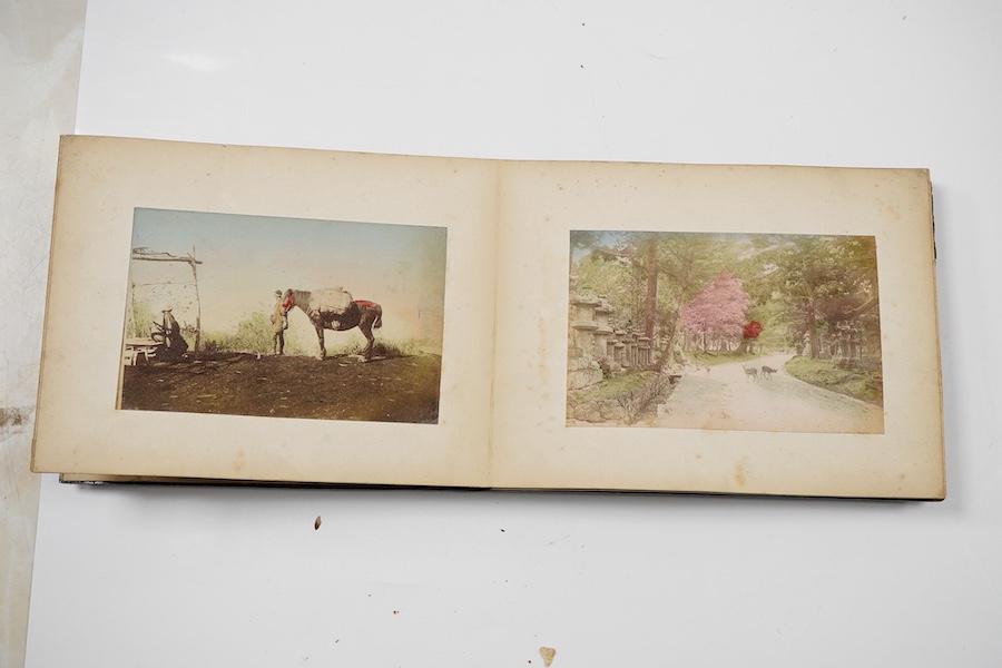An early 20th century Japanese bone inlaid lacquer photograph album containing coloured photographs of people and Japanese scenes.19.5cm wide x 15.5cm high